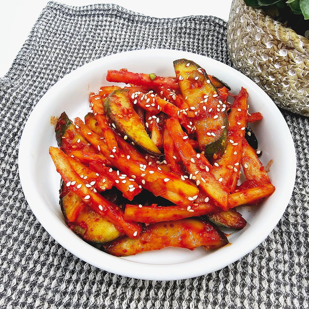 Close-up view of Oi doraji-muchim (Korean cucumber and balloon flower root salad) – small family size | Banchan365