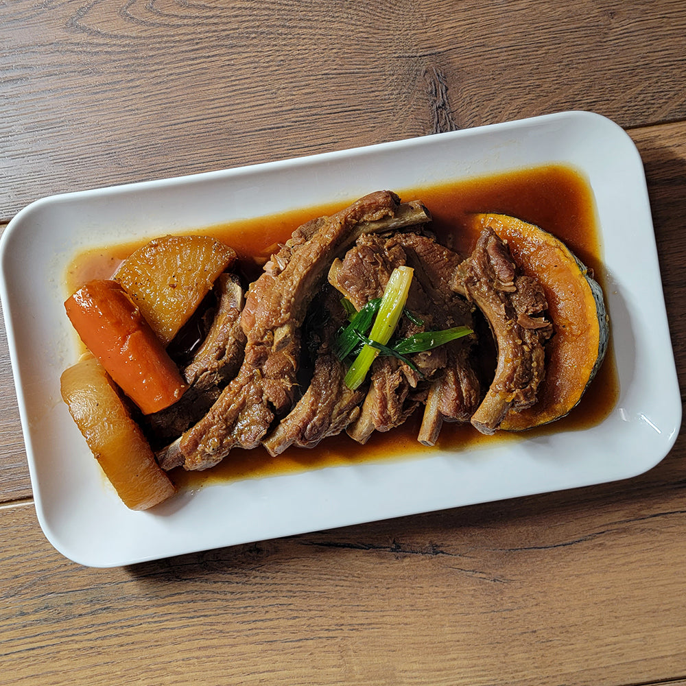 Close-up view of Ganjang dwaeji-galbi-jjim (Korean soy-braised pork ribs) | Banchan365