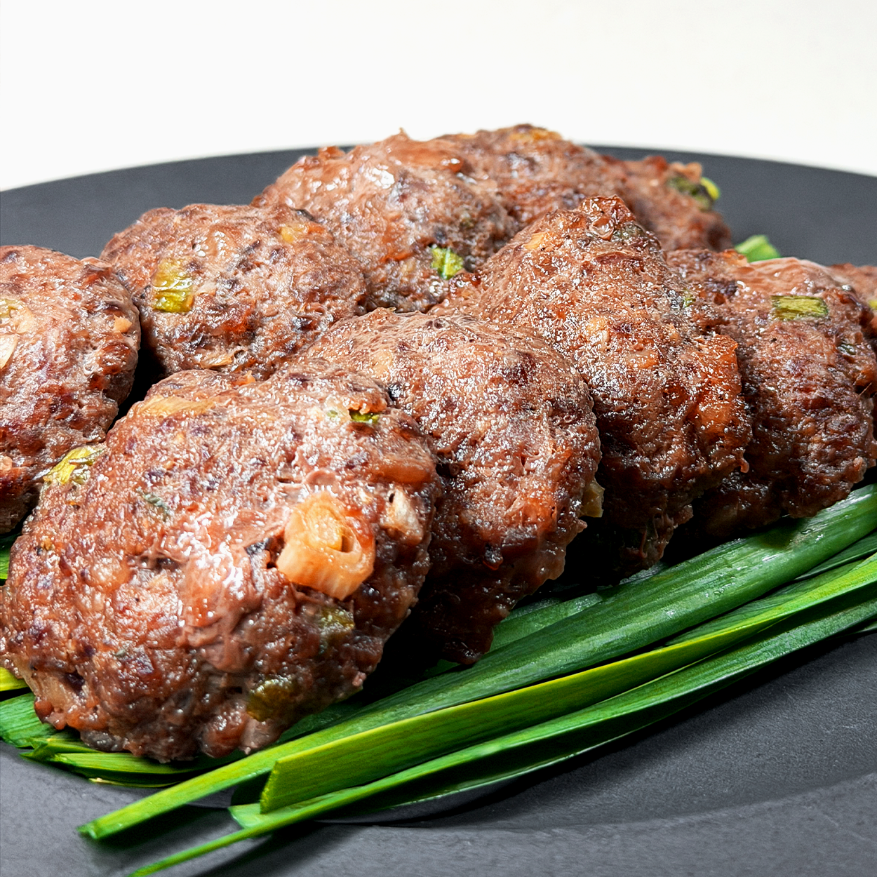Damyang mini tteokgalbi (Korean grilled beef short rib patties, Jeolla regional specialty) served and plated | Banchan365