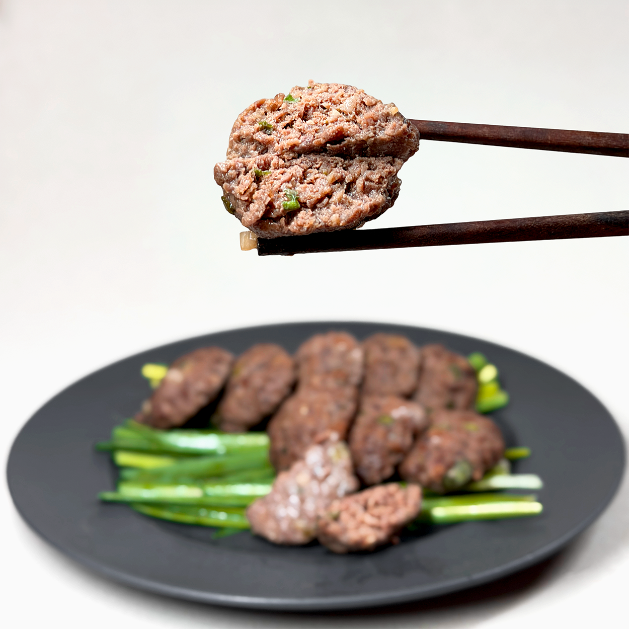 Close-up view of Damyang mini tteokgalbi (Korean grilled beef short rib patties, Jeolla regional specialty) | Banchan365