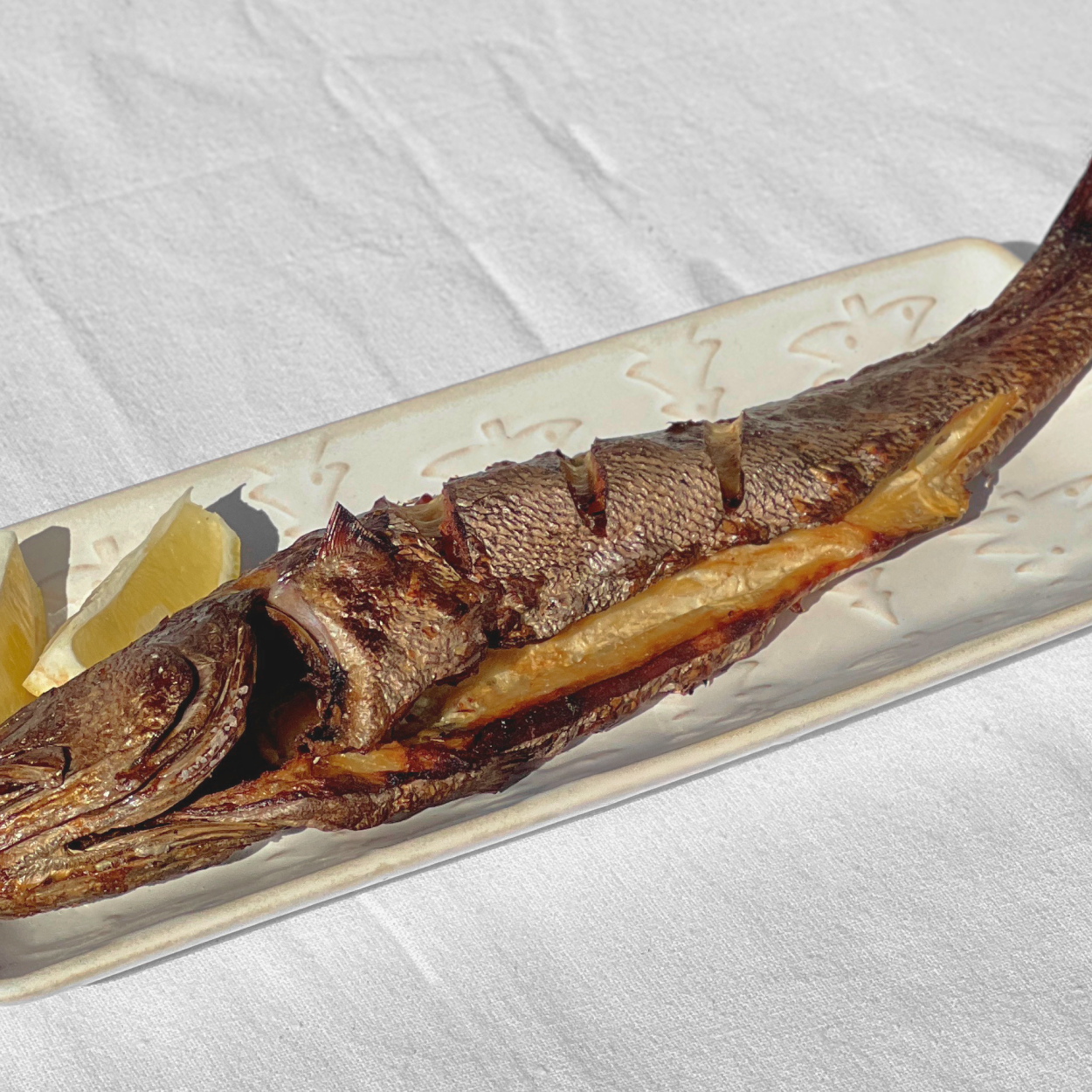 Beopseongpo gulbi (Korean grilled brown croaker, Beopseongpo specialty) served and plated | Banchan365