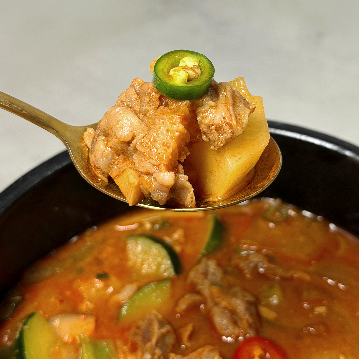 Close-up view of Doenjang-jjigae (Korean soybean paste stew, BBQ-house style) | Banchan365
