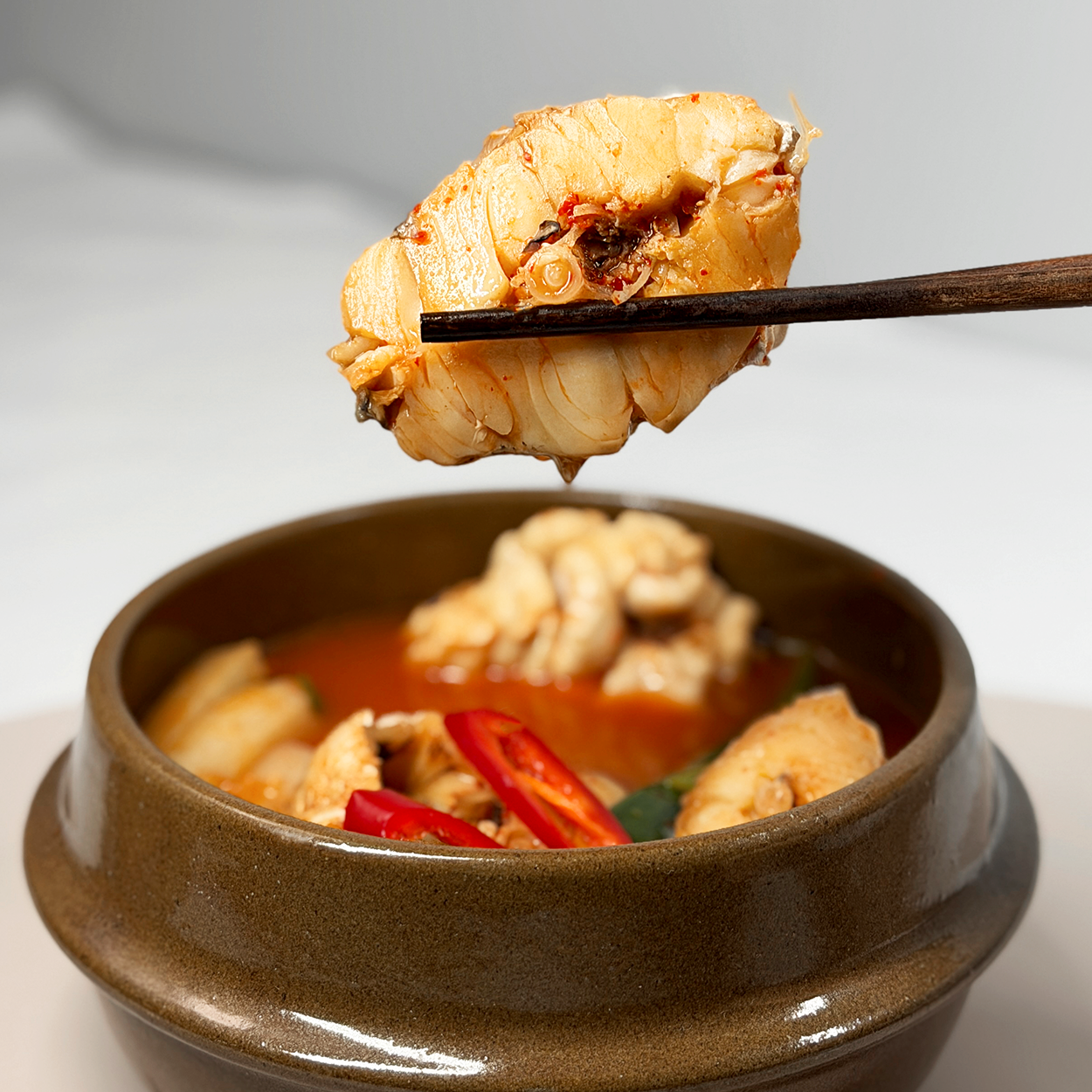 Goni dongtae-jjigae (Korean pollack roe stew) served and plated | Banchan365