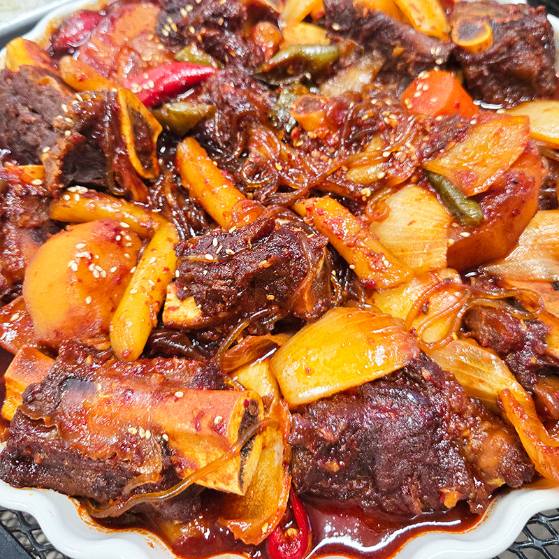 Close-up view of Maeun deunggalbi-jjim (Korean spicy braised beef back ribs) | Banchan365