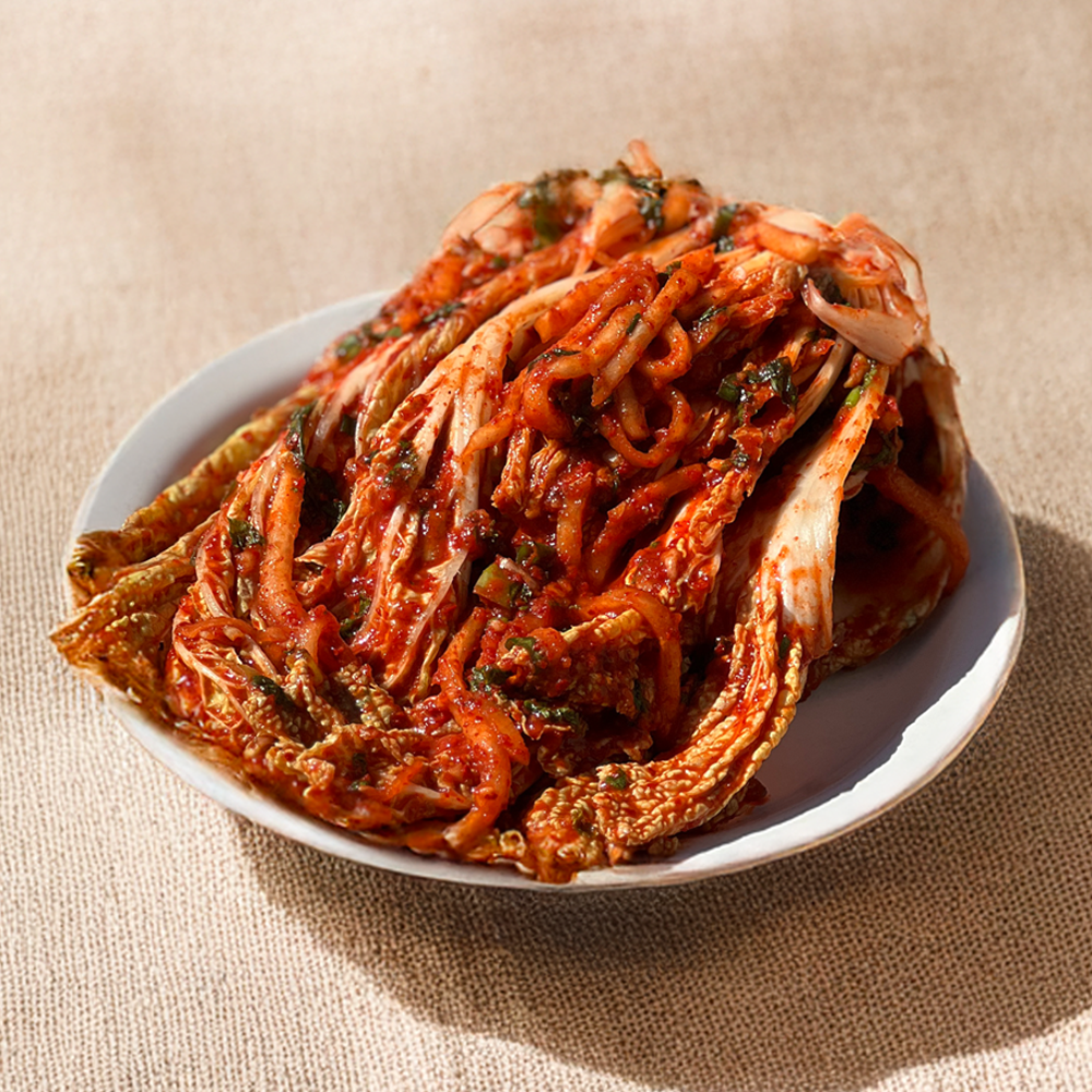 Close-up view of Premium poggi-kimchi (Korean whole napa cabbage kimchi) | Banchan365