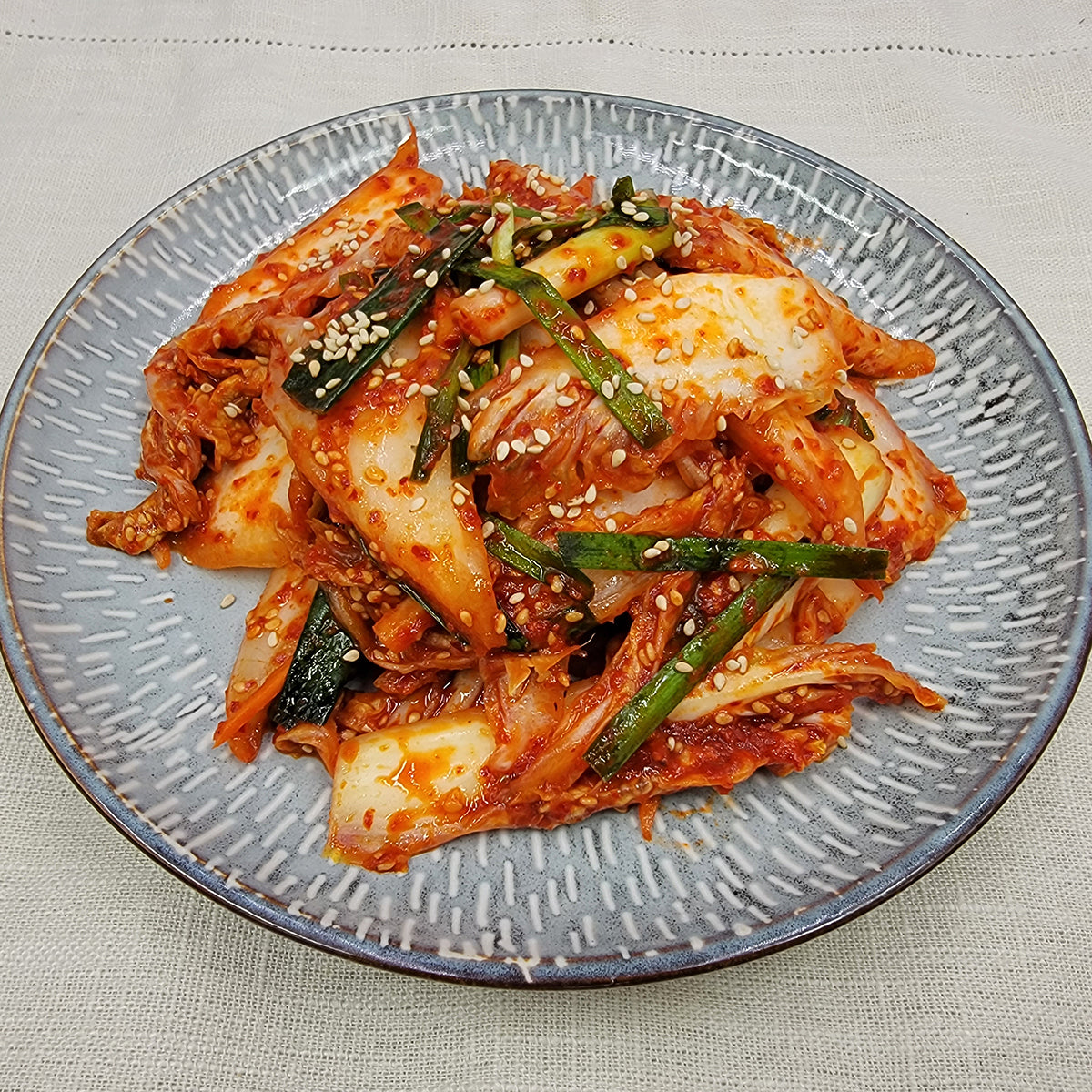 Close-up view of Baechu-geotjeori (Korean fresh napa cabbage kimchi) – 3 servings | Banchan365