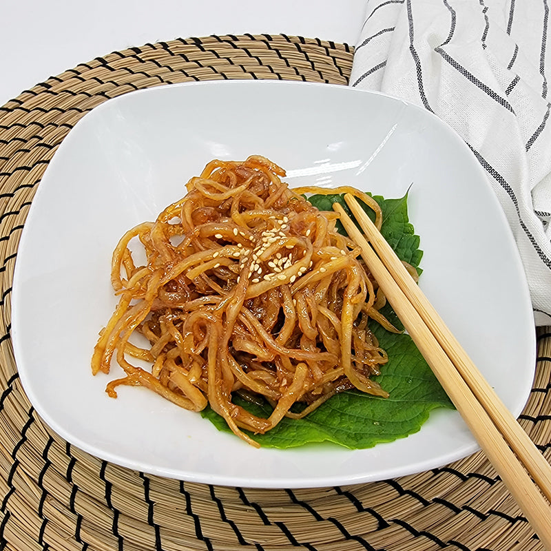 Close-up view of Ganjang jinmichae (Korean soy-marinated dried squid strips) – large size | Banchan365