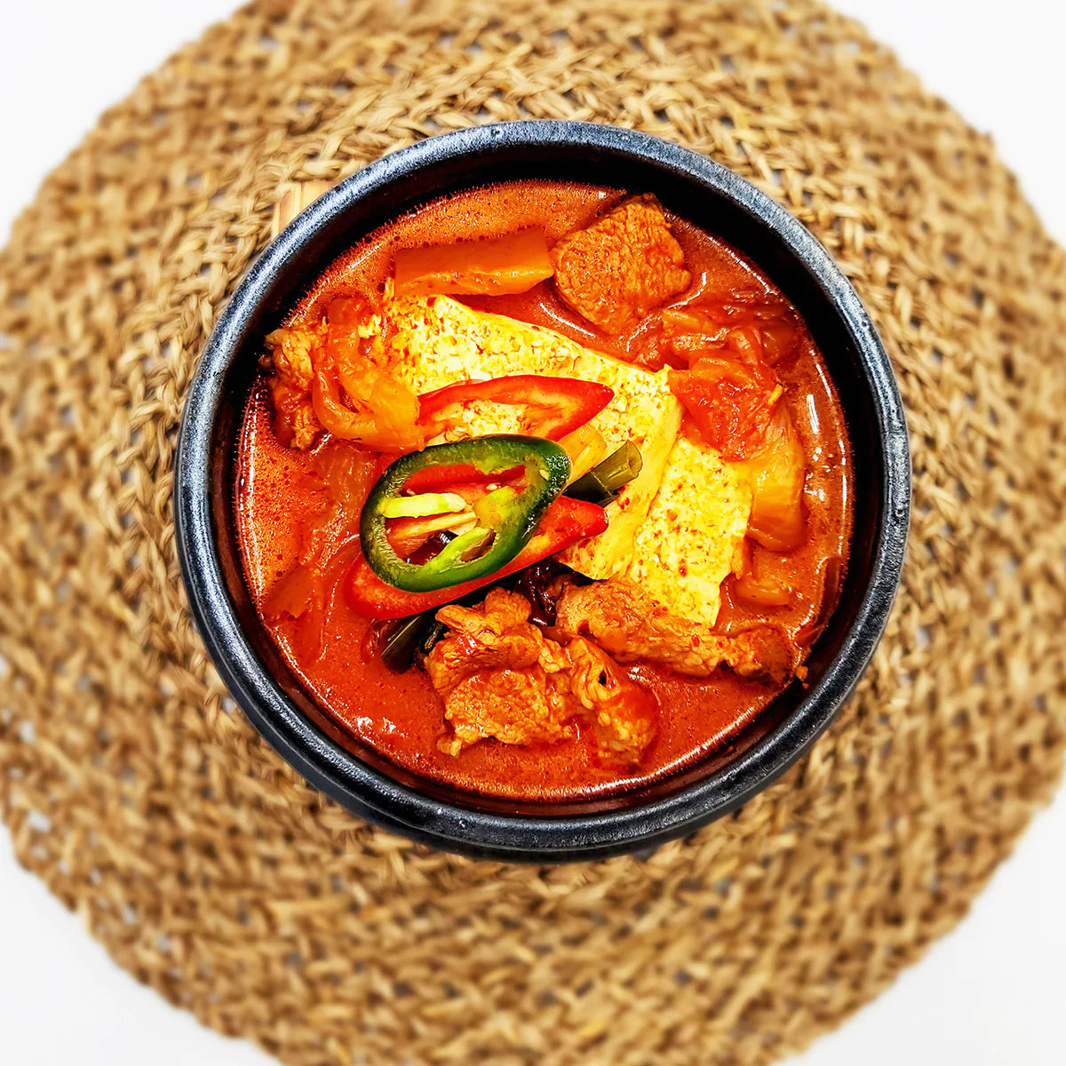 Close-up view of Kimchi-jjigae (Korean kimchi pork belly stew, taxi driver style) – 2 servings | Banchan365