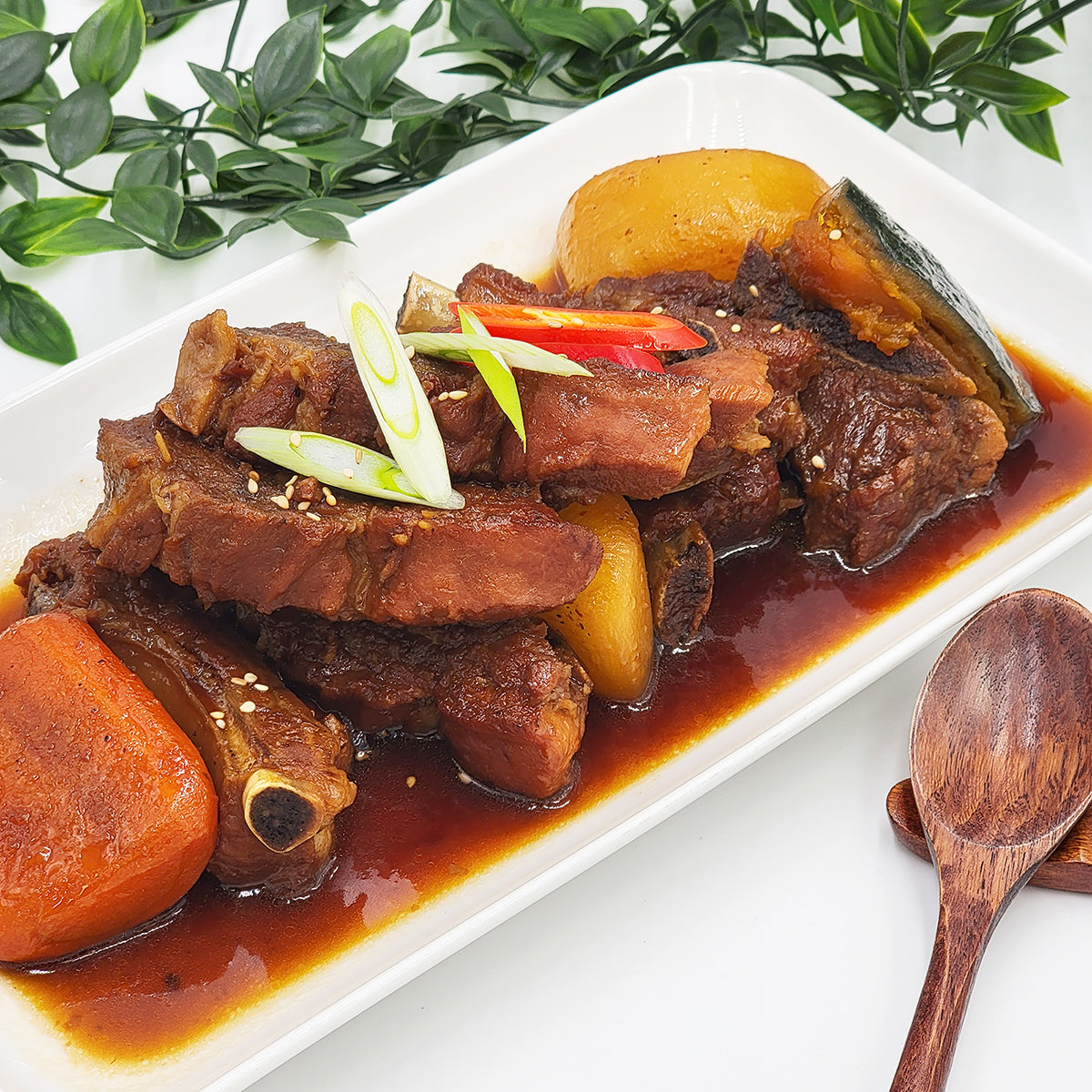Ganjang dwaeji-galbi-jjim (Korean soy-braised pork ribs) served and plated | Banchan365