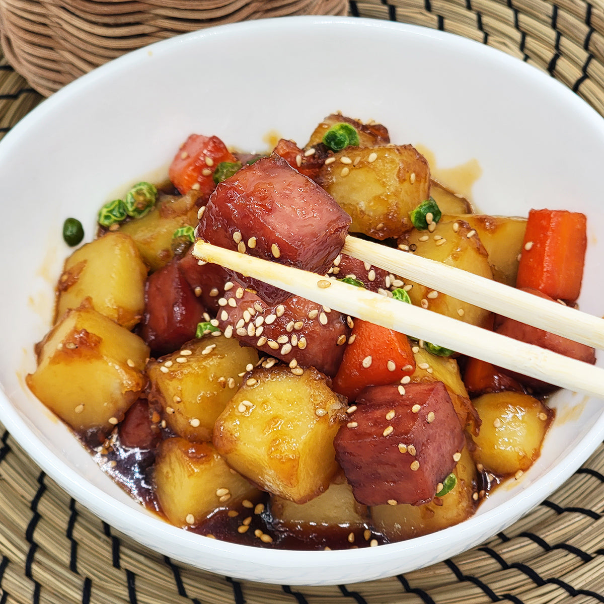 Close-up view of Gamja Spam-jorim (Korean braised potato with Spam) | Banchan365