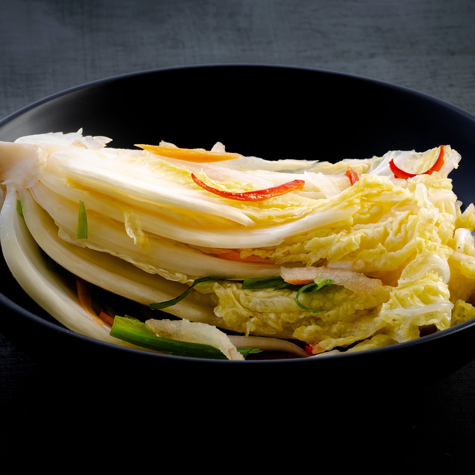 Baek-kimchi (Korean white kimchi, non-spicy) served and plated | Banchan365