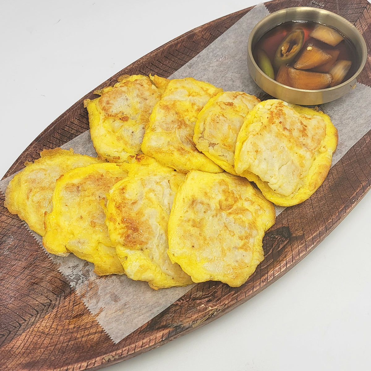 Close-up view of Dongtae-jeon (Korean pan-fried pollack pancake) | Banchan365