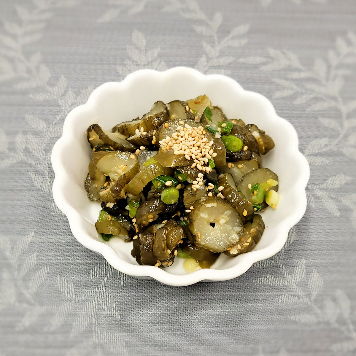 Close-up view of Oi-jangajji muchim (Korean pickled cucumber salad) – small family size | Banchan365