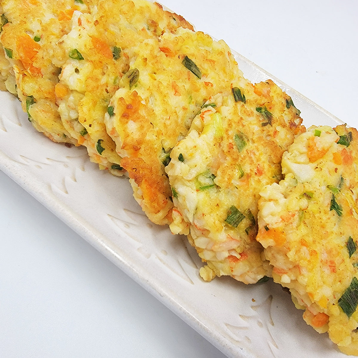 Close-up view of Gemassal saeu yachae-jeon (Korean crab stick shrimp vegetable pancake) | Banchan365