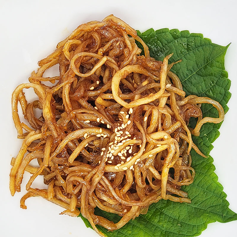 Ganjang jinmichae (Korean soy-marinated dried squid strips) – large size served and plated | Banchan365