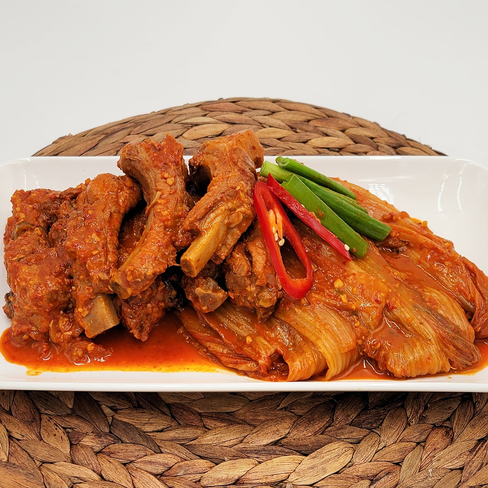 Dwaeji-galbi kimchi-jjim (Korean braised pork back ribs with kimchi) served and plated | Banchan365