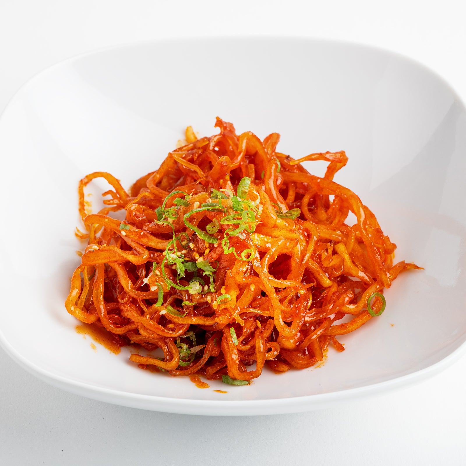 Close-up view of Gochujang jinmichae (Korean spicy dried squid strips) – large size | Banchan365