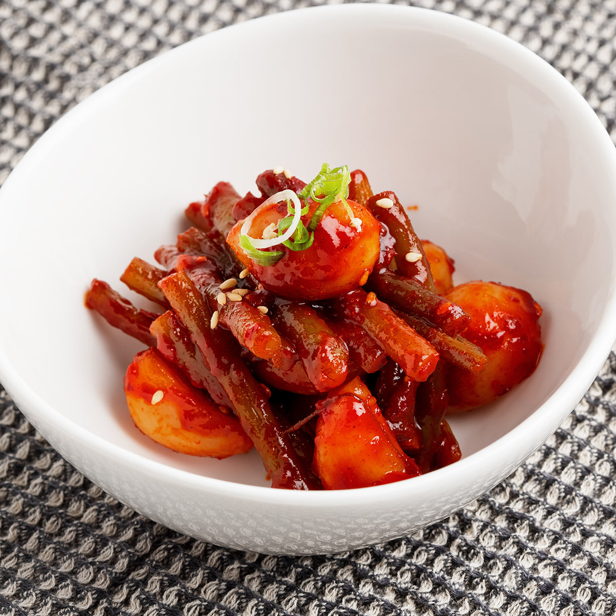 Maneul maneuljjong-muchim (Korean seasoned garlic and garlic scapes) – small family size served and plated | Banchan365