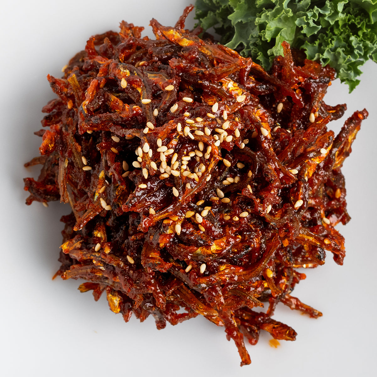 Close-up view of Gochujang myeolchi-bokkeum (Korean spicy stir-fried anchovies) – small family size | Banchan365