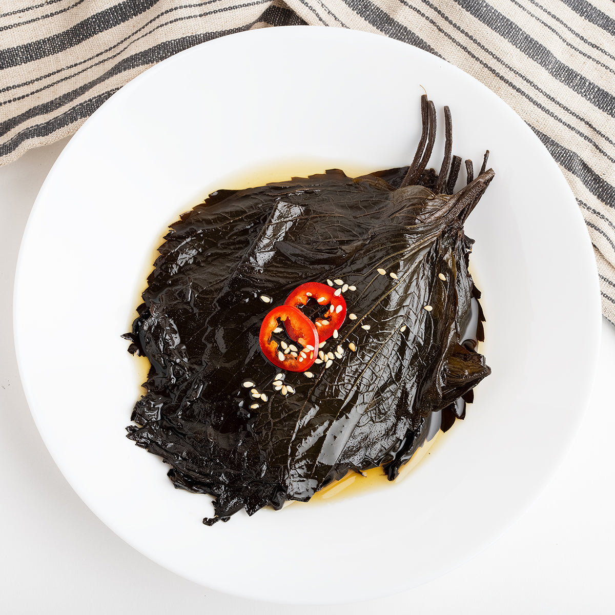 Ganjang kkaennip-jeorim (Korean soy-marinated perilla leaves) – large size served and plated | Banchan365