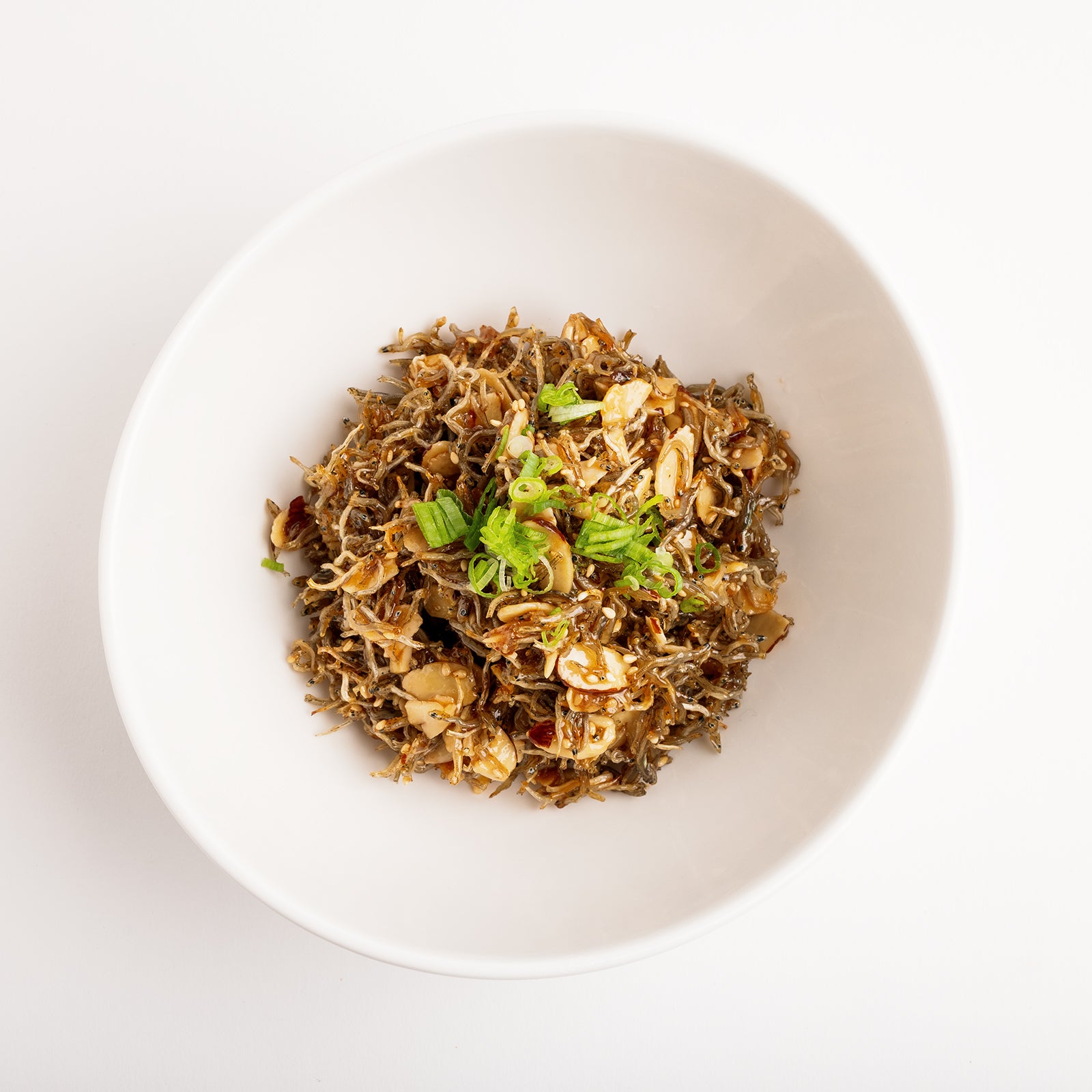 Close-up view of Almond myeolchi-bokkeum (Korean stir-fried anchovies with almonds) – large size | Banchan365