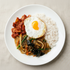 Close-up view of Korean japchae rice bowl frozen lunchbox – glass noodle | Banchan365