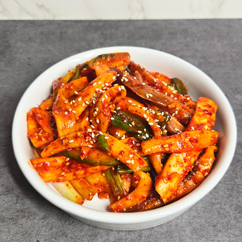 Ojingeo chomuchim (Korean spicy vinegared squid salad) served and plated | Banchan365