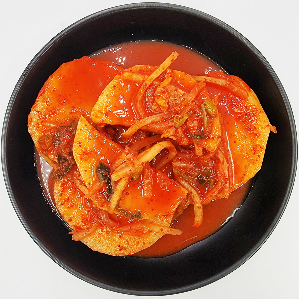 Jeju seokbakji (Korean sliced radish kimchi, Jeju style) served and plated | Banchan365