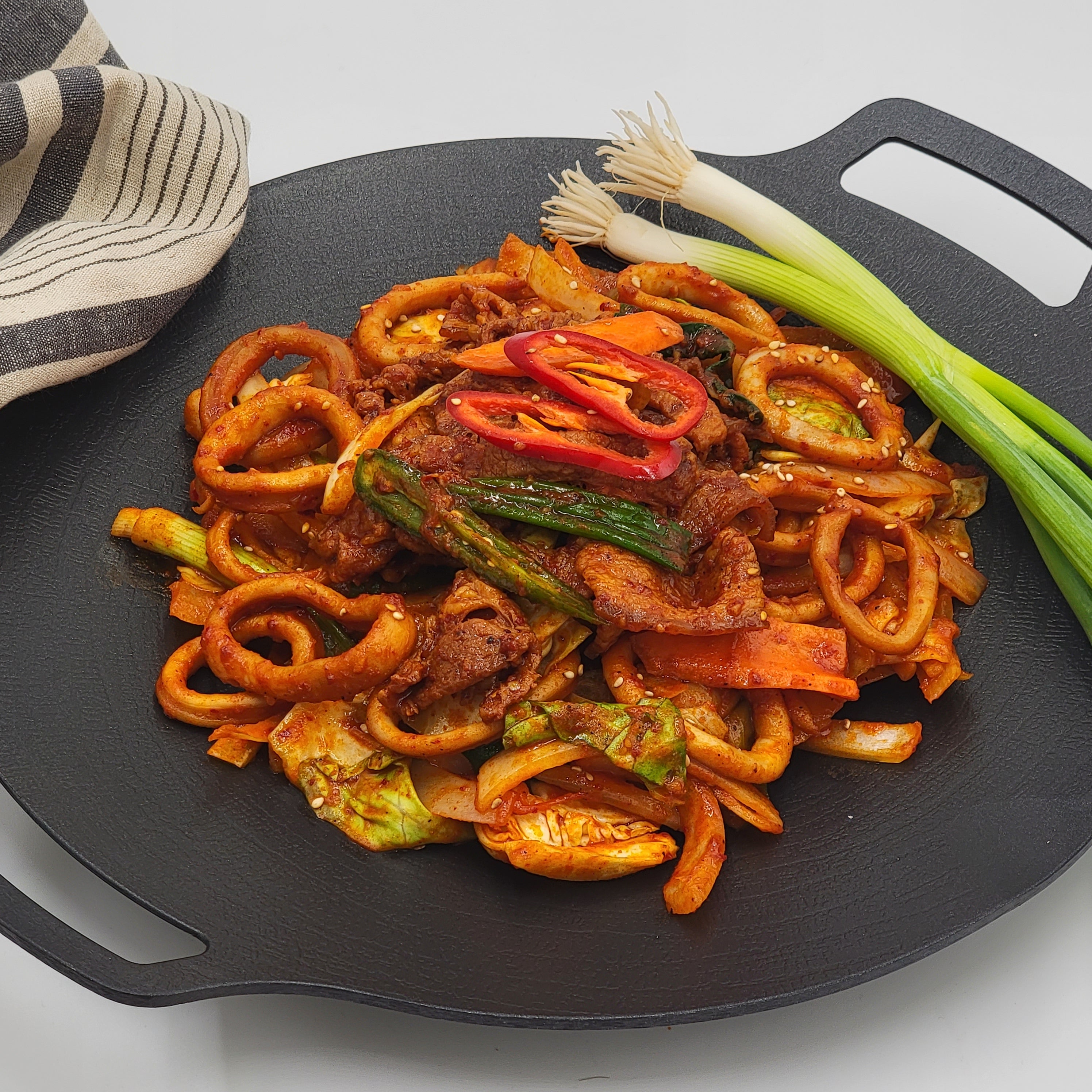 Close-up view of Ojingeo samgyeopsal-bokkeum (Korean stir-fried squid and pork belly) – 1.5 lb | Banchan365